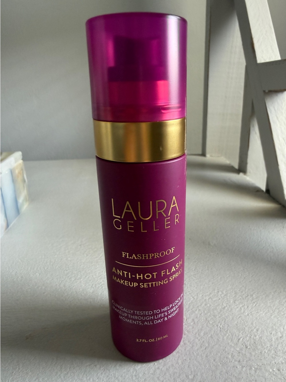 Laura Geller Makeup Setting Spray in Magenta with Gold Trim